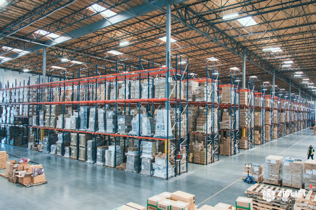 Rows of industrial pallet racks loaded with pallets in a Fresno warehouse